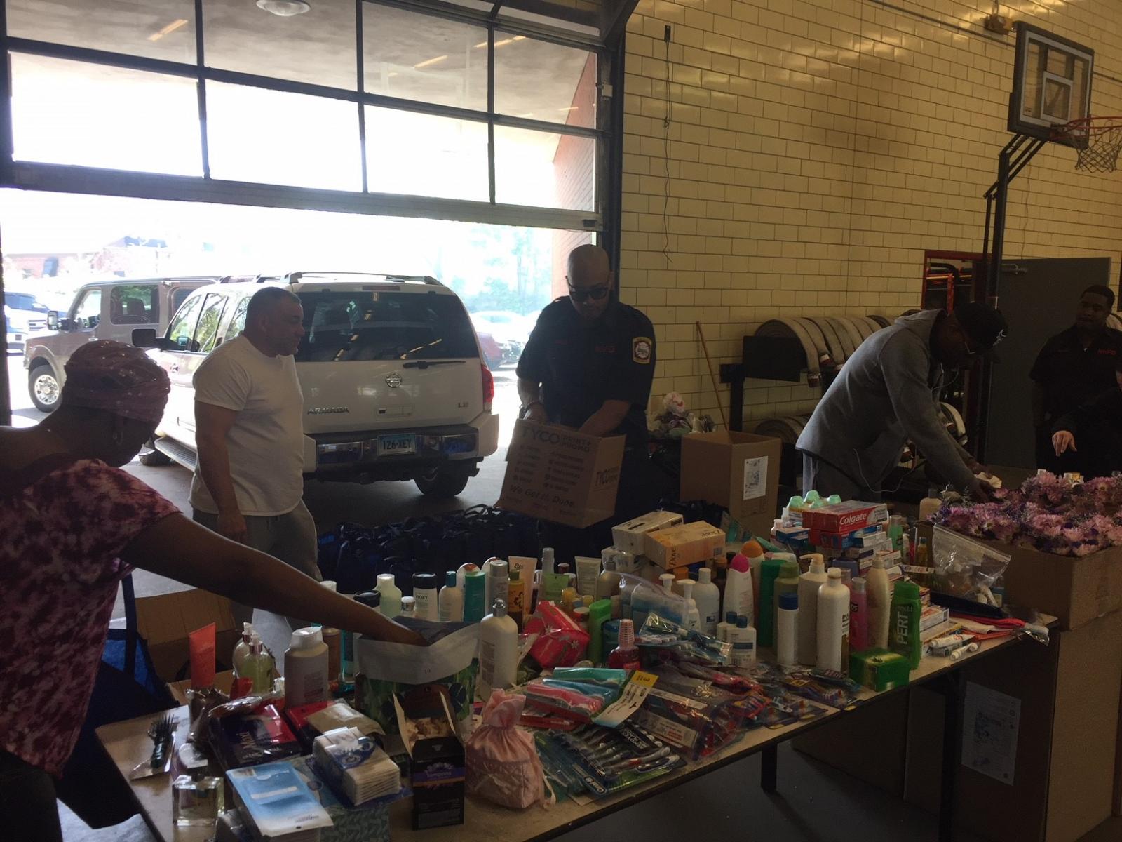 People inside warehouse with donations.