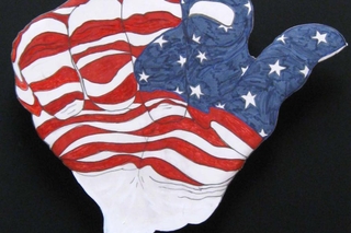 Flag painted hand with index finger pointed at viewer.