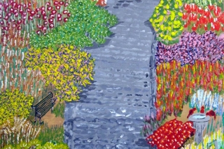 Flowers on both sides of a small stream.