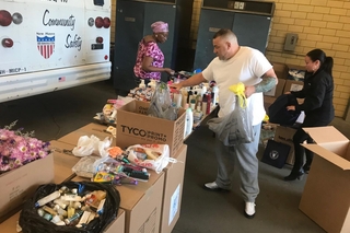 People putting together donation boxes.