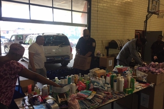 People inside warehouse with donations.