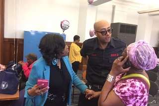 Two ladies talking to a New Haven Fire Department person.